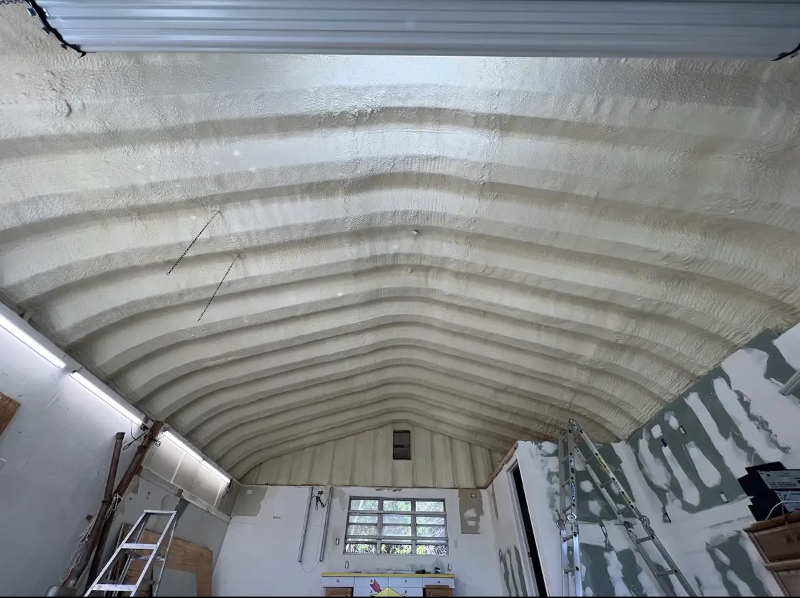 Spray polyurethane foam applied to the underside of a metal roof deck in Fort Campbell North